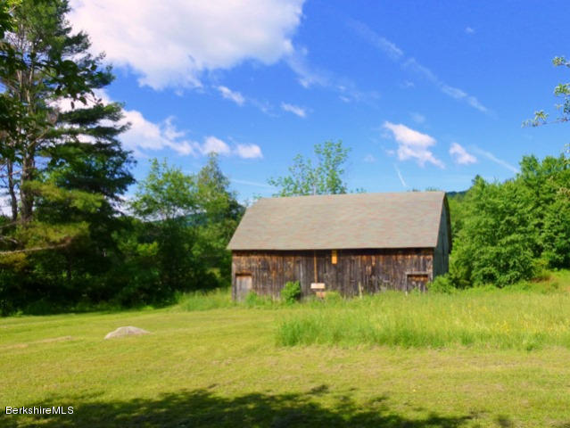 457 Horrigan Road Clarksburg, MA 01247 - Photo 21 of 32 a view of house with garden space and swimming pool