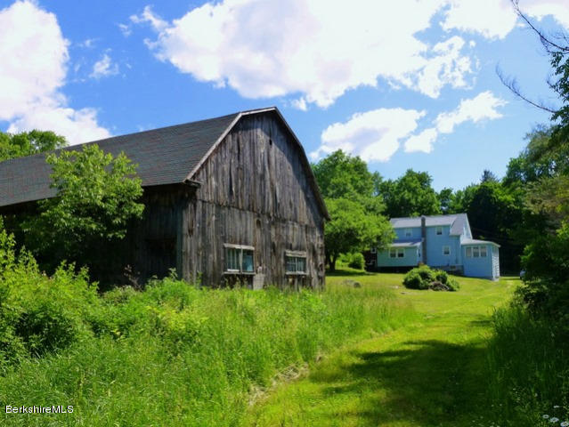 457 Horrigan Road Clarksburg, MA 01247 - Photo 23 of 32 a backyard of a house with lots of green space