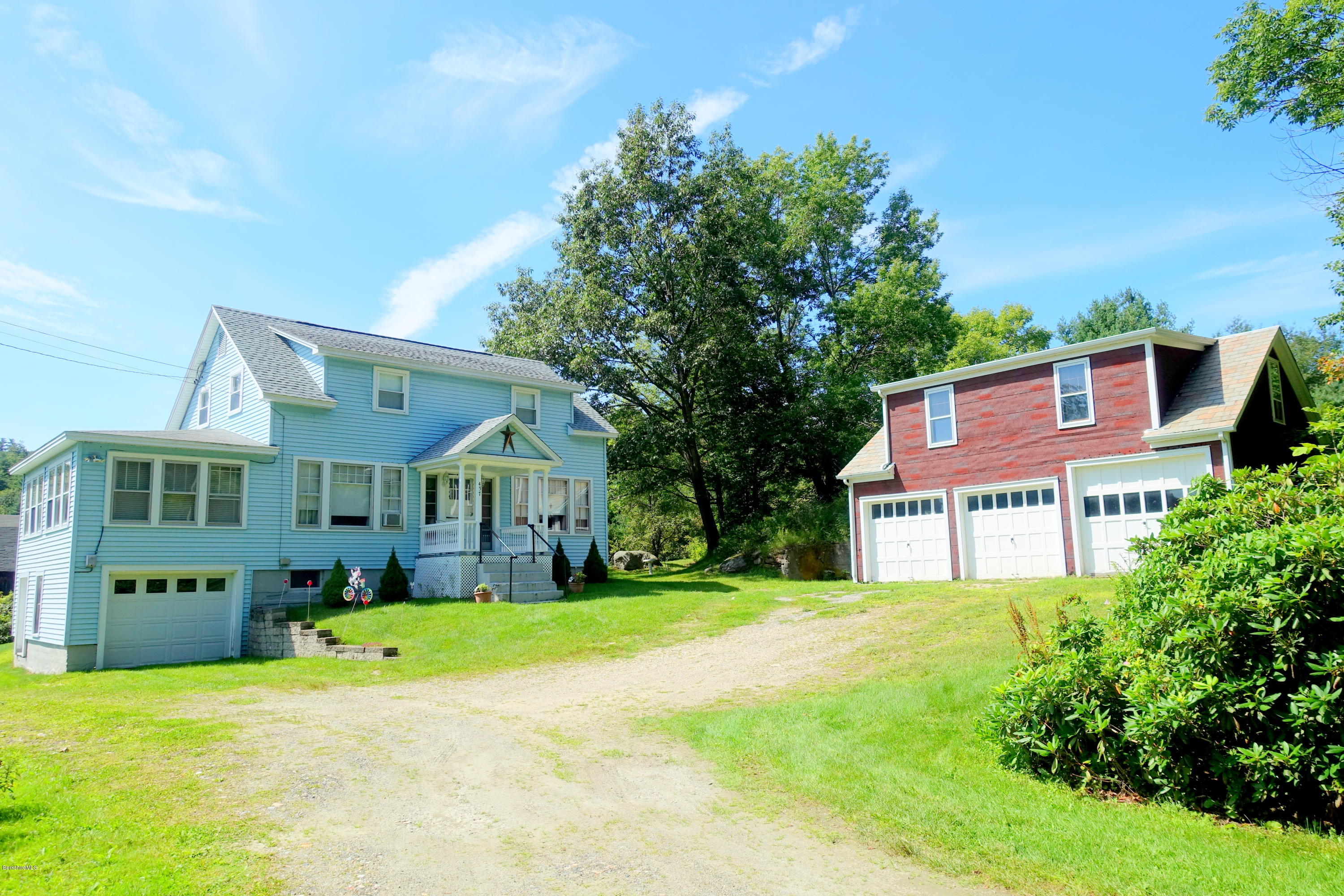 457 Horrigan Road Clarksburg, MA 01247 - Photo 4 of 32 a view of a house with a big yard and large trees