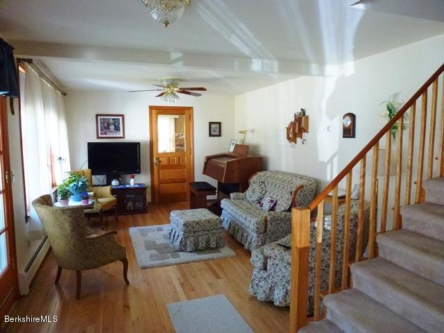 457 Horrigan Road Clarksburg, MA 01247 - Photo 8 of 32 a living room with furniture or wooden floor and a flat screen tv