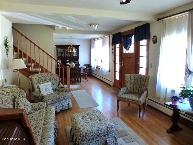 457 Horrigan Road Clarksburg, MA 01247 - Photo 9 of 32 a living room with furniture and wooden floor