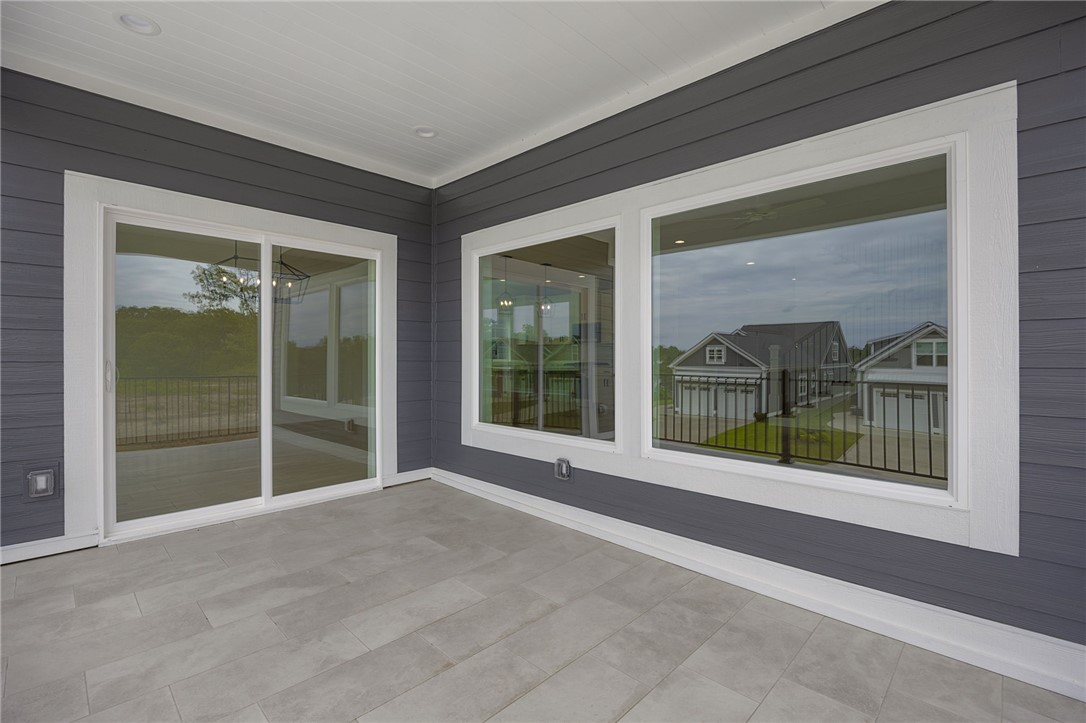 1230 Melton Road, Unit 216 West Union, SC 29696 - Photo 14 of 49 A spacious covered patio with tile flooring and a sliding glass door offers inviting outdoor living.