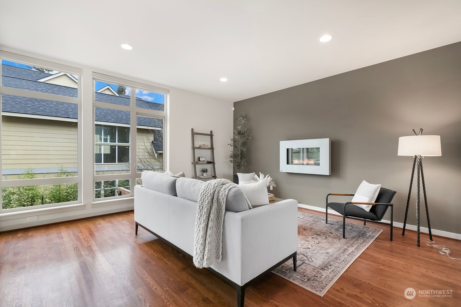 2832 Northwest 65th Street Seattle, WA 98117 - Photo 12 of 38 a living room with furniture and a large window