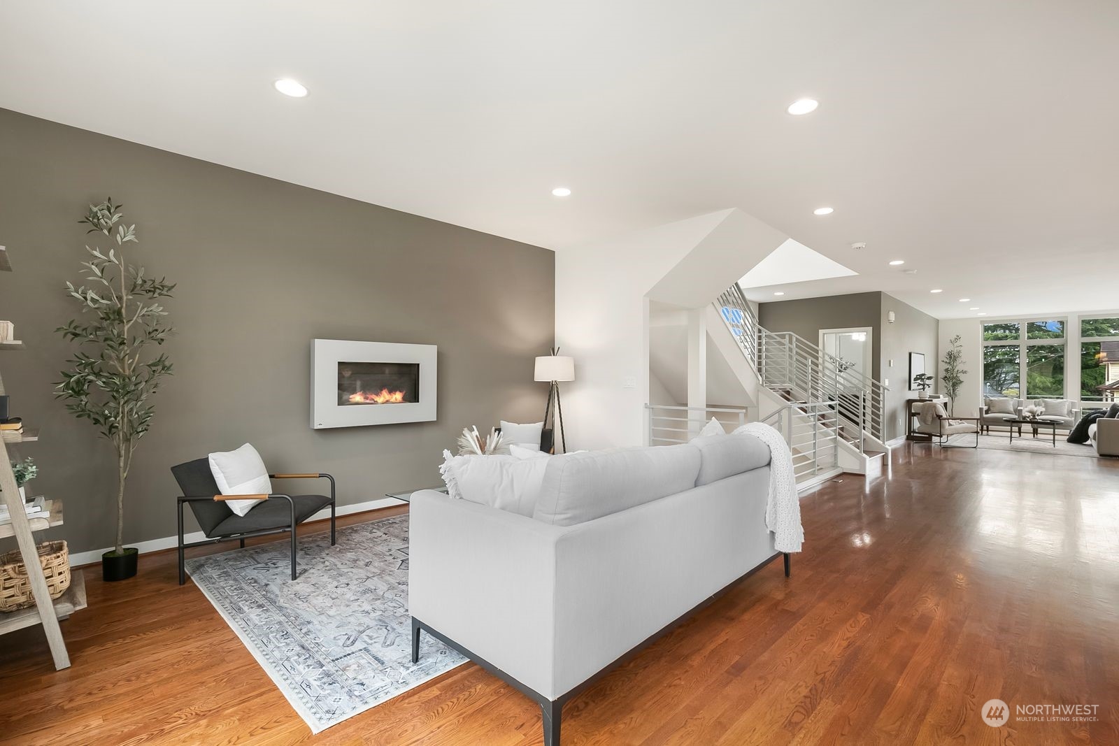 2832 Northwest 65th Street Seattle, WA 98117 - Photo 13 of 38 a living room with furniture and a large window