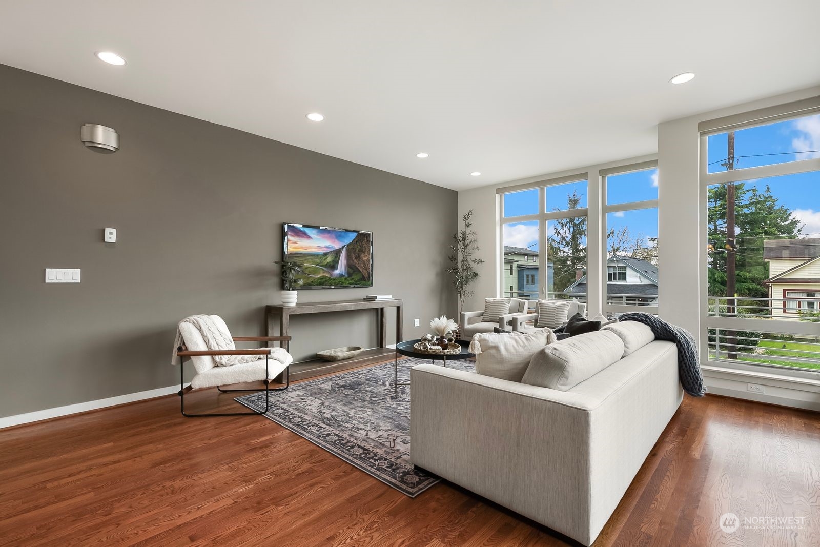 2832 Northwest 65th Street Seattle, WA 98117 - Photo 14 of 38 a living room with furniture and a floor to ceiling window