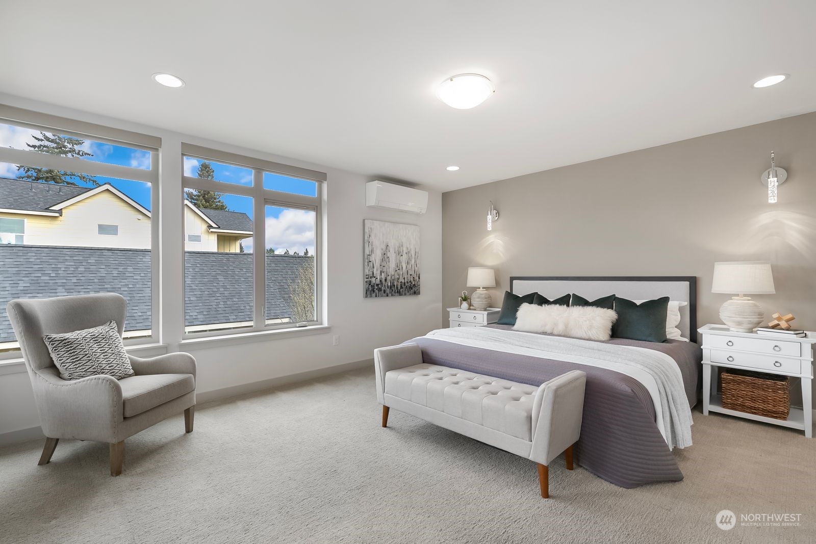 2832 Northwest 65th Street Seattle, WA 98117 - Photo 16 of 38 a spacious bedroom with a bed and glass window