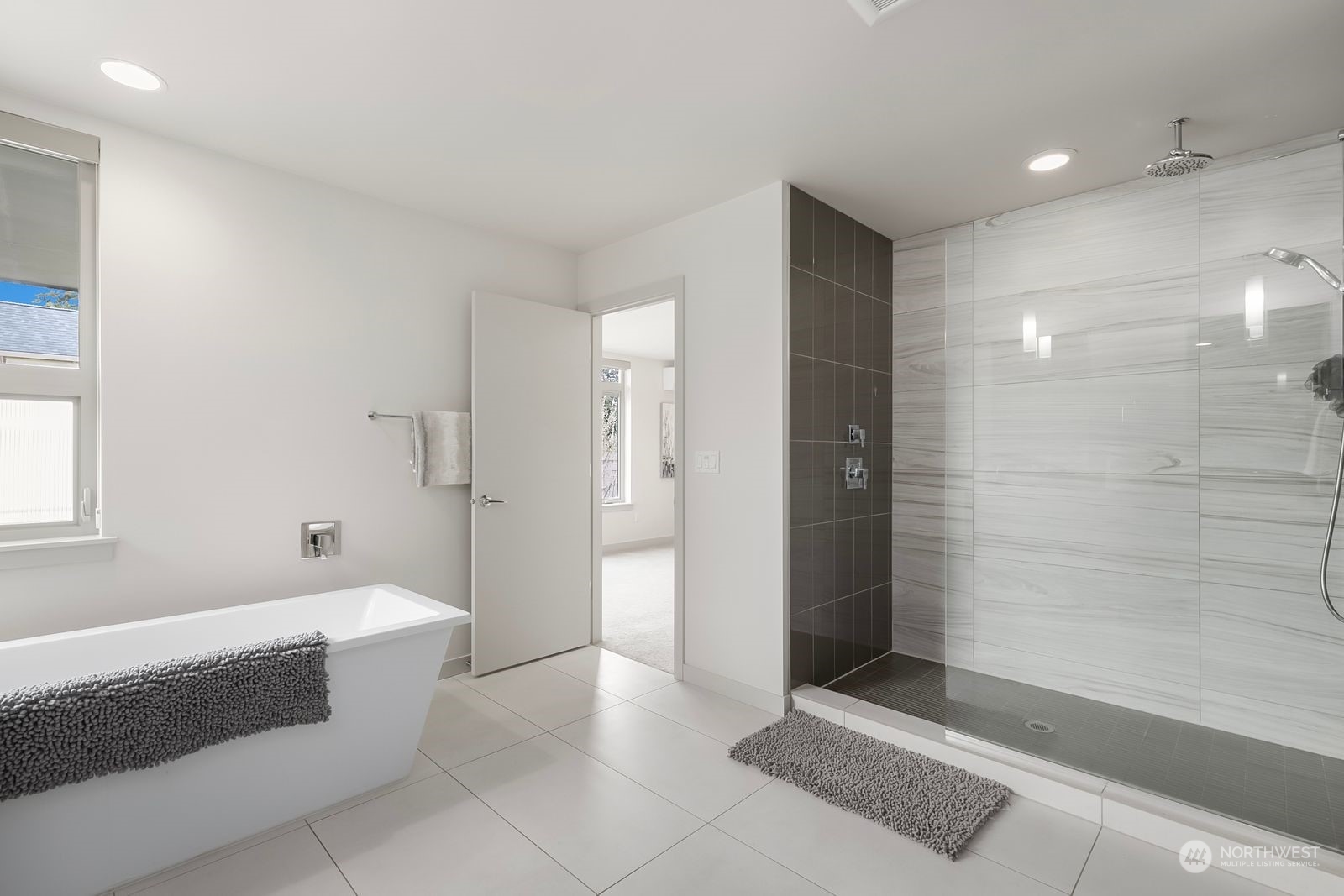 2832 Northwest 65th Street Seattle, WA 98117 - Photo 19 of 38 a spacious bathroom with a bathtub and shower