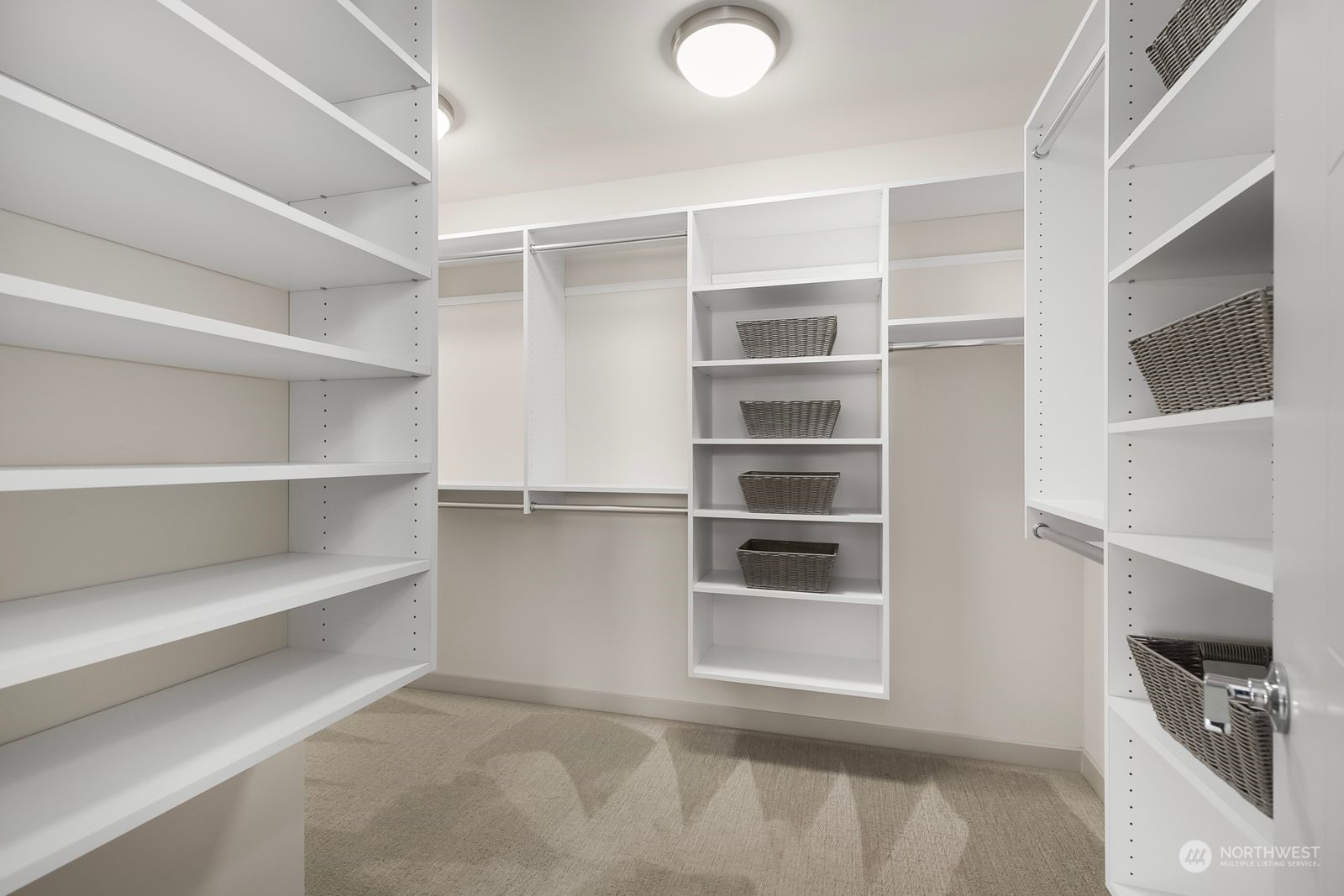 2832 Northwest 65th Street Seattle, WA 98117 - Photo 20 of 38 a view of a room with shelves on the wall