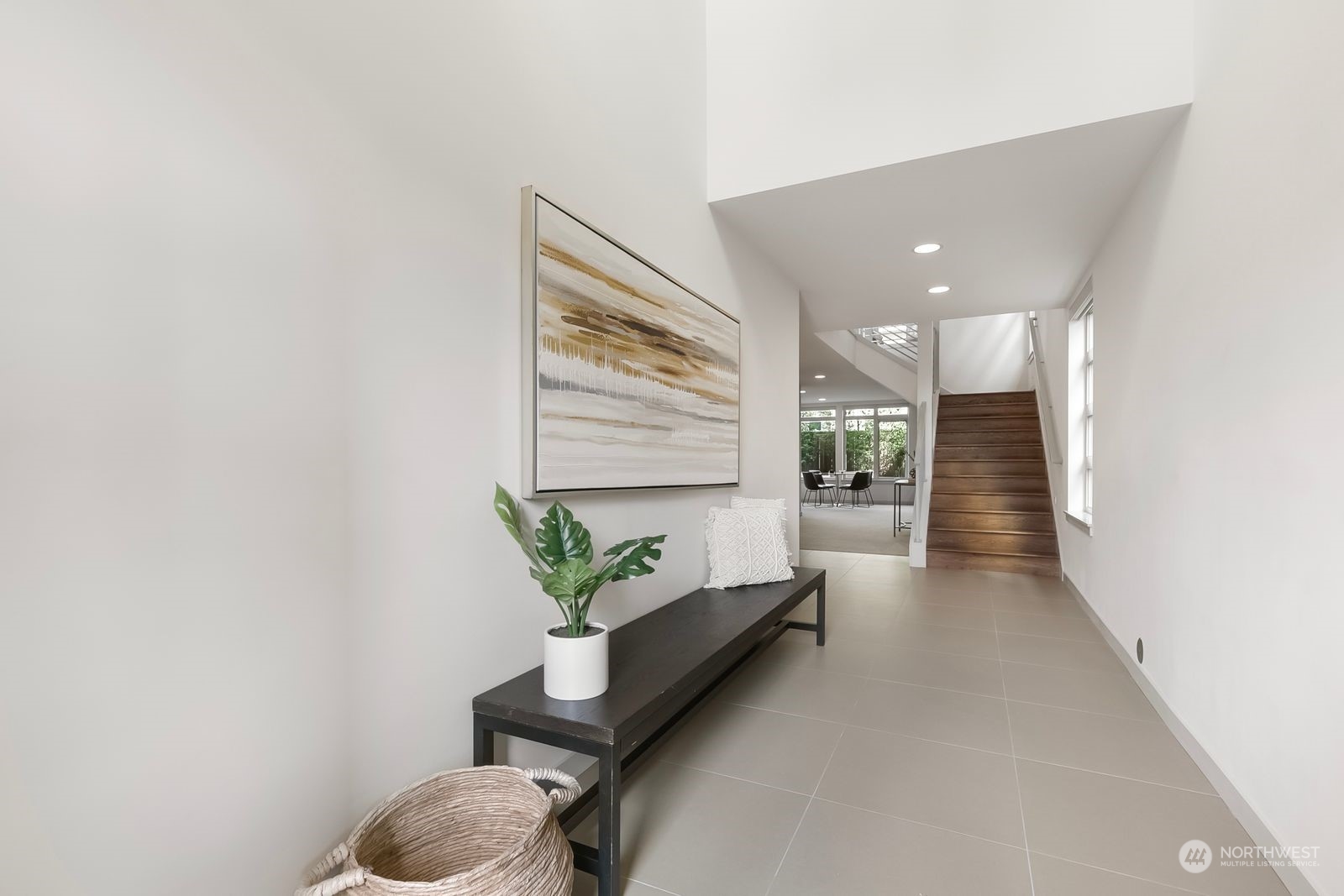 2832 Northwest 65th Street Seattle, WA 98117 - Photo 2 of 38 a lobby with furniture and a potted plant
