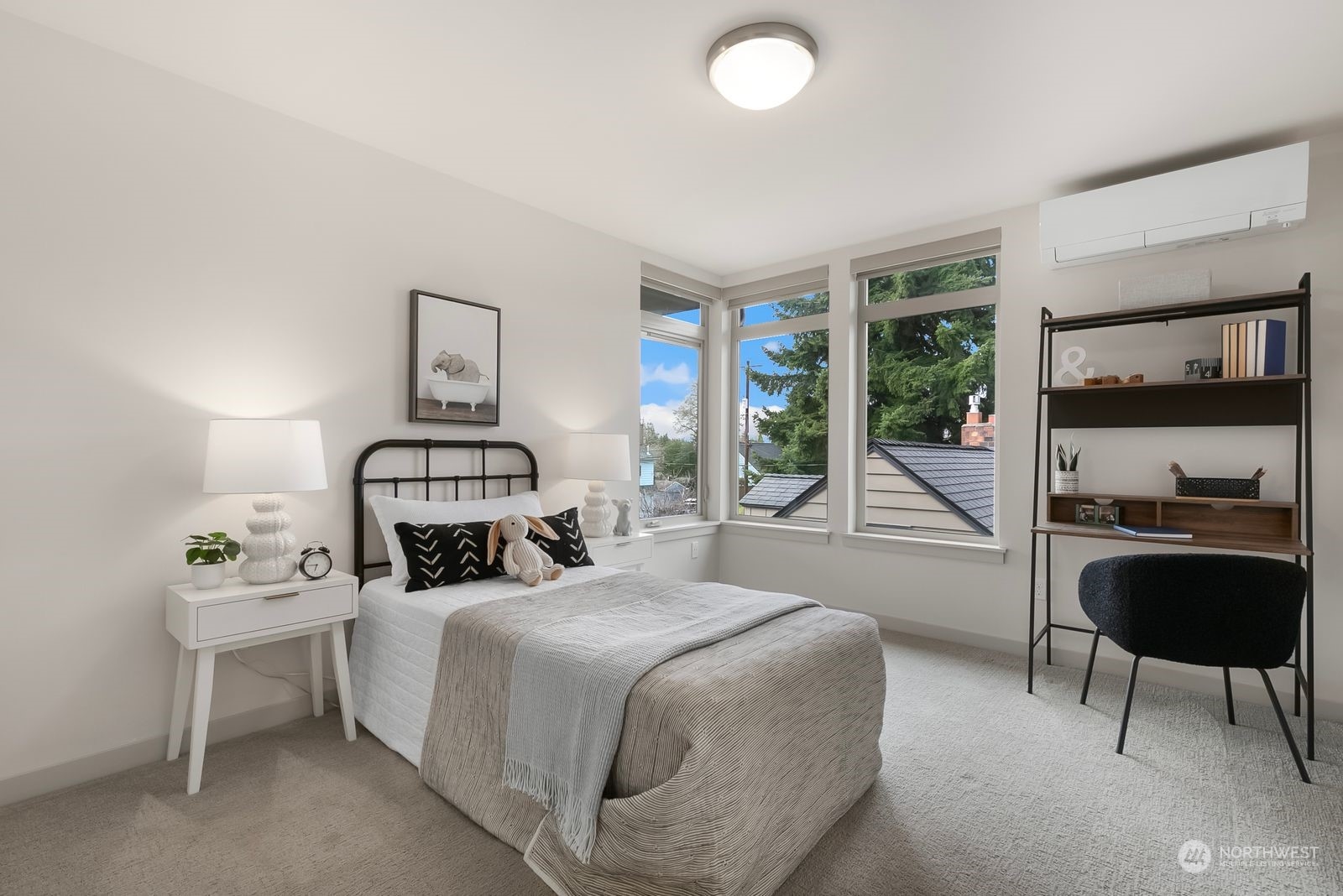 2832 Northwest 65th Street Seattle, WA 98117 - Photo 21 of 38 a bedroom with a bed and a chandelier