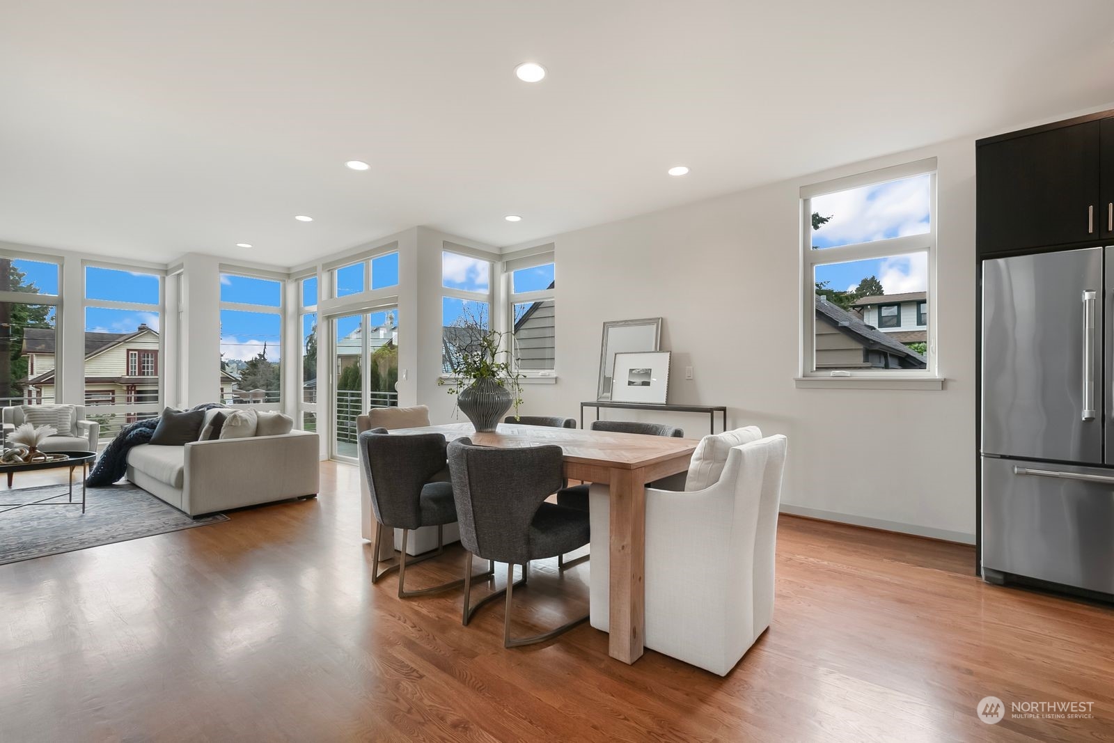 2832 Northwest 65th Street Seattle, WA 98117 - Photo 7 of 38 a view of a dining room with furniture a rug and wooden floor