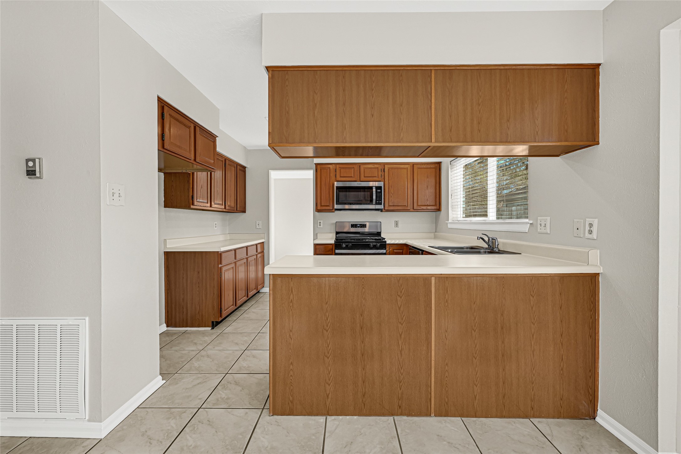 10210 Crooks Way Court Houston, TX 77065 - Photo 21 of 50 a kitchen with stainless steel appliances granite countertop a refrigerator and a stove top oven