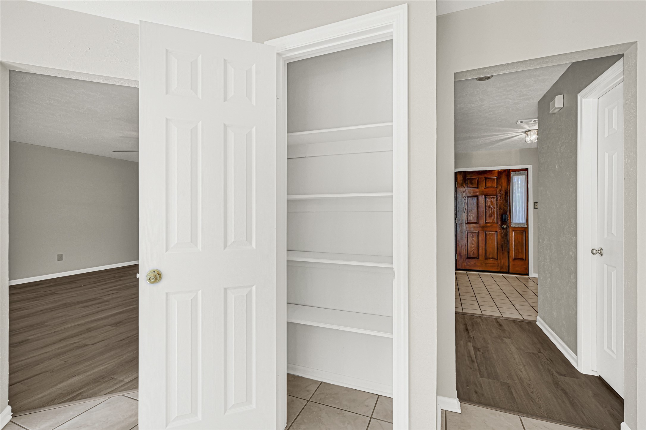10210 Crooks Way Court Houston, TX 77065 - Photo 25 of 50 a view of a hallway with wooden floor and closet