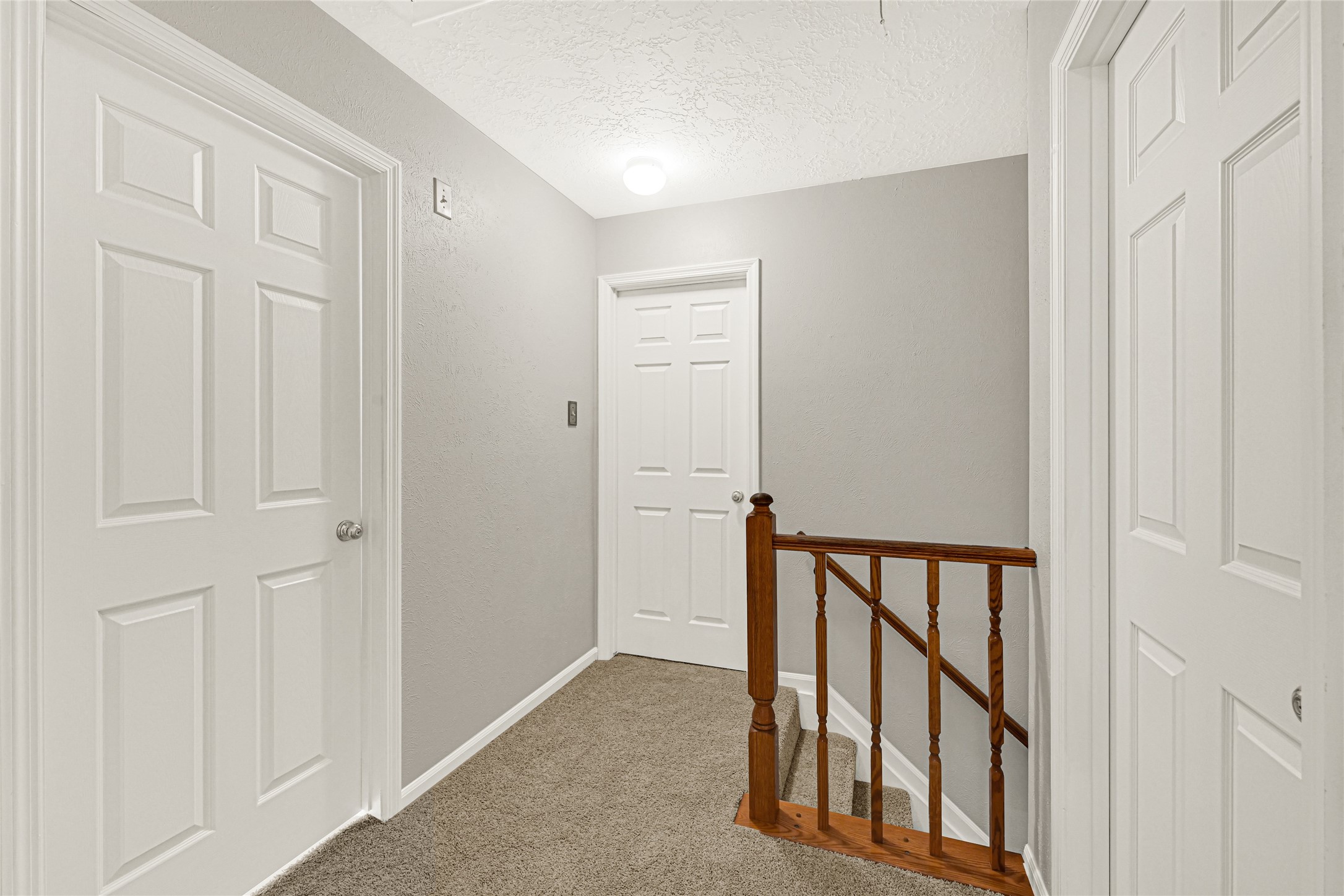 10210 Crooks Way Court Houston, TX 77065 - Photo 27 of 50 a view of a hallway with wooden floor and entryway