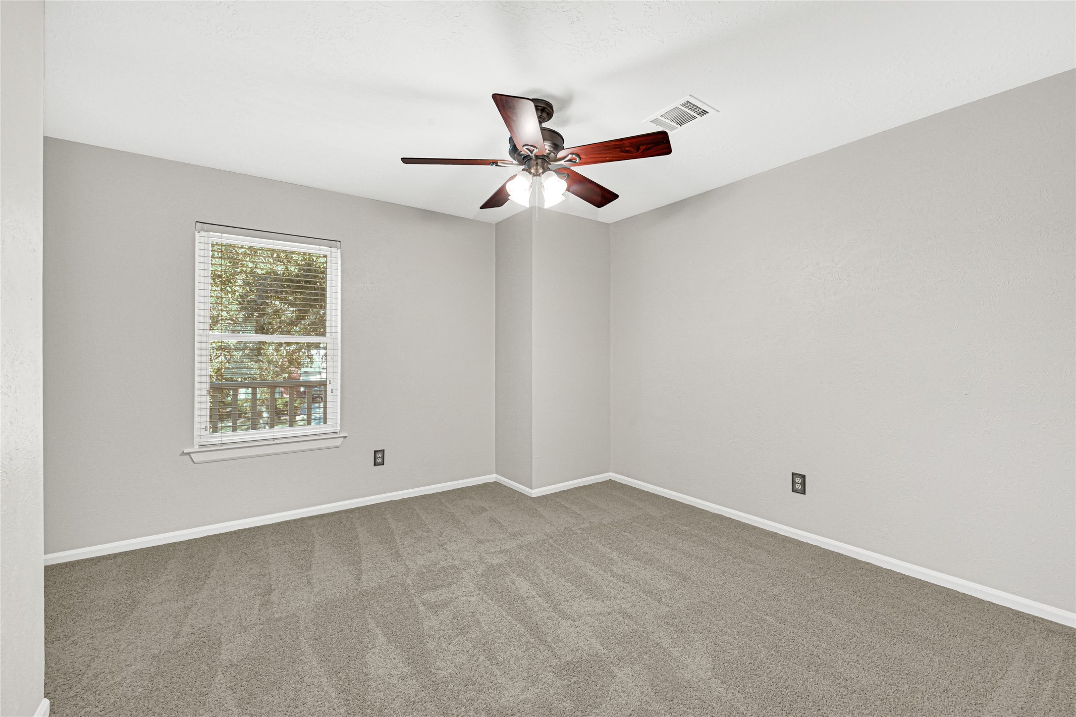 10210 Crooks Way Court Houston, TX 77065 - Photo 30 of 50 a view of an empty room with a window