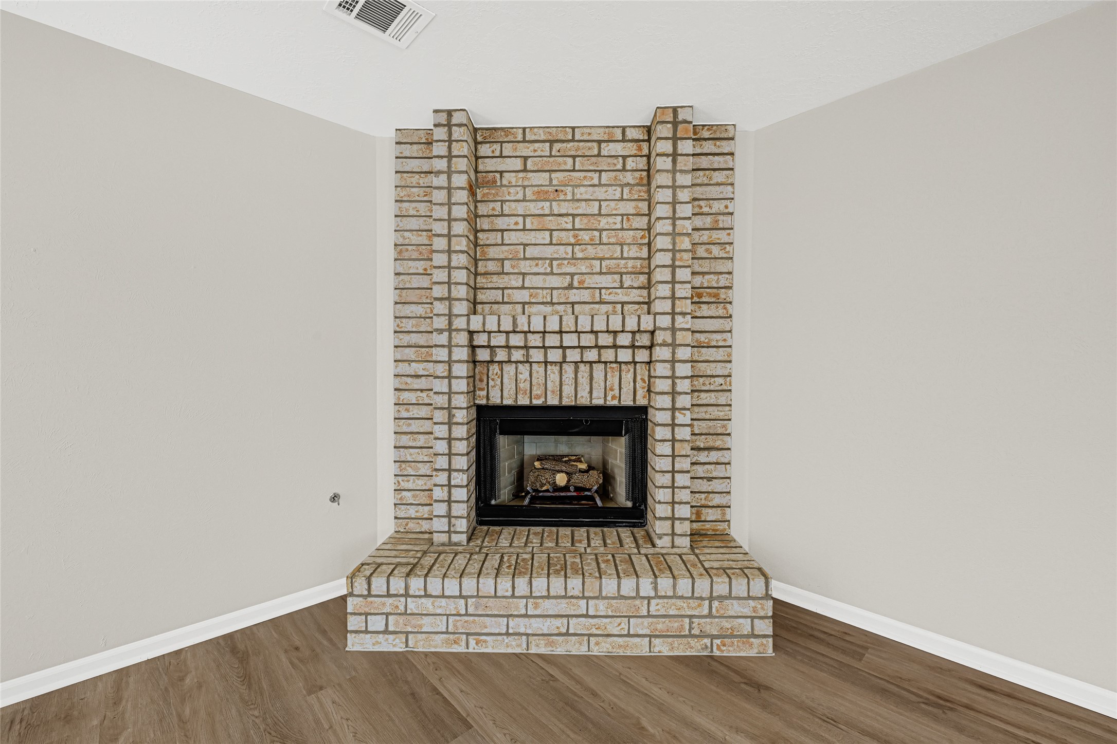 10210 Crooks Way Court Houston, TX 77065 - Photo 3 of 50 a view of fireplace and wooden floor