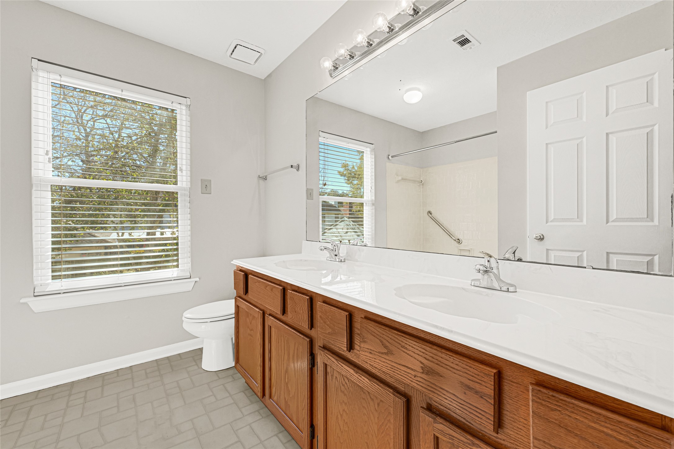 10210 Crooks Way Court Houston, TX 77065 - Photo 36 of 50 a bathroom with a granite countertop sink mirror vanity and a bathtub