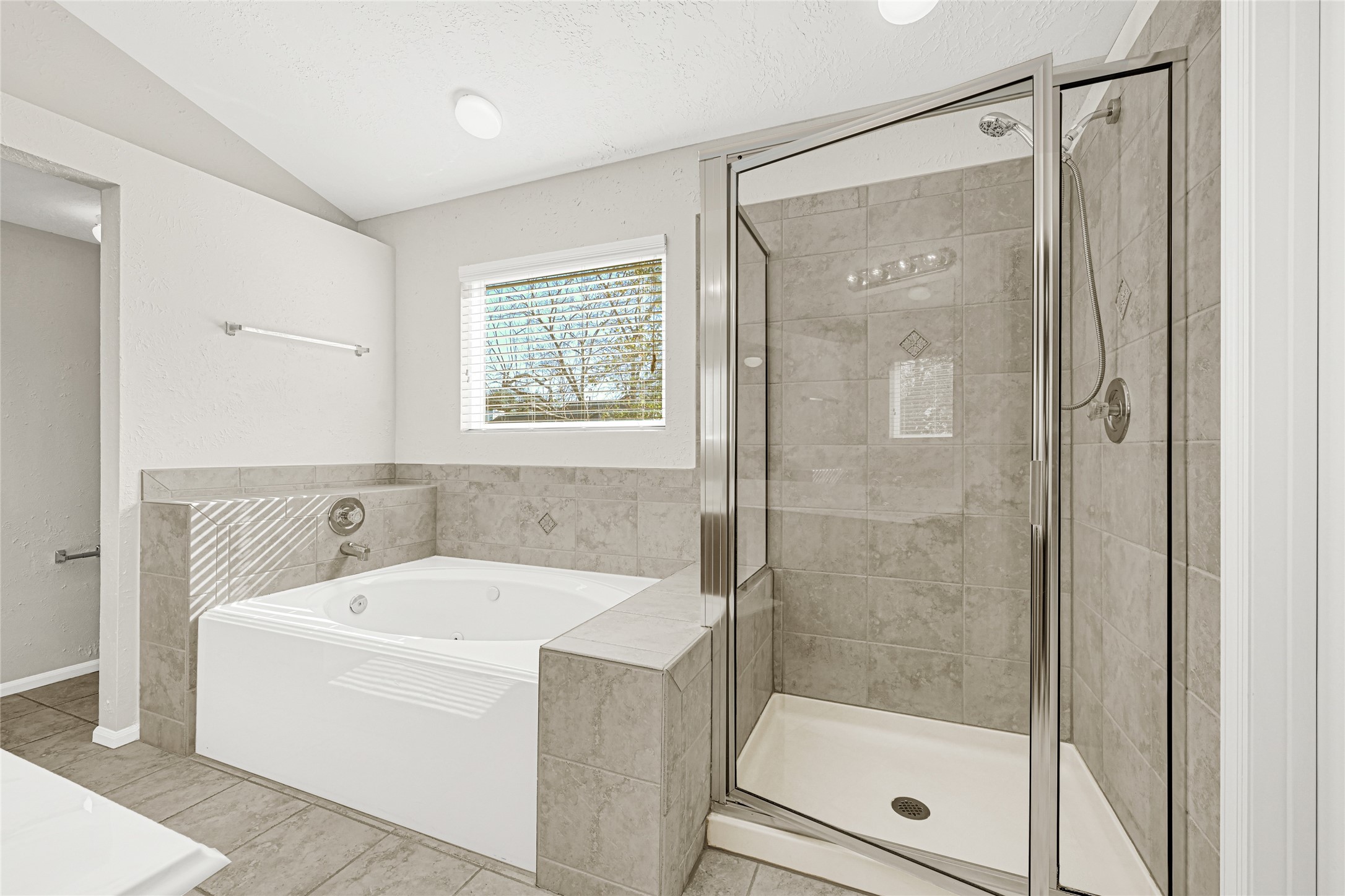 10210 Crooks Way Court Houston, TX 77065 - Photo 5 of 50 a white bath tub sitting next to a shower