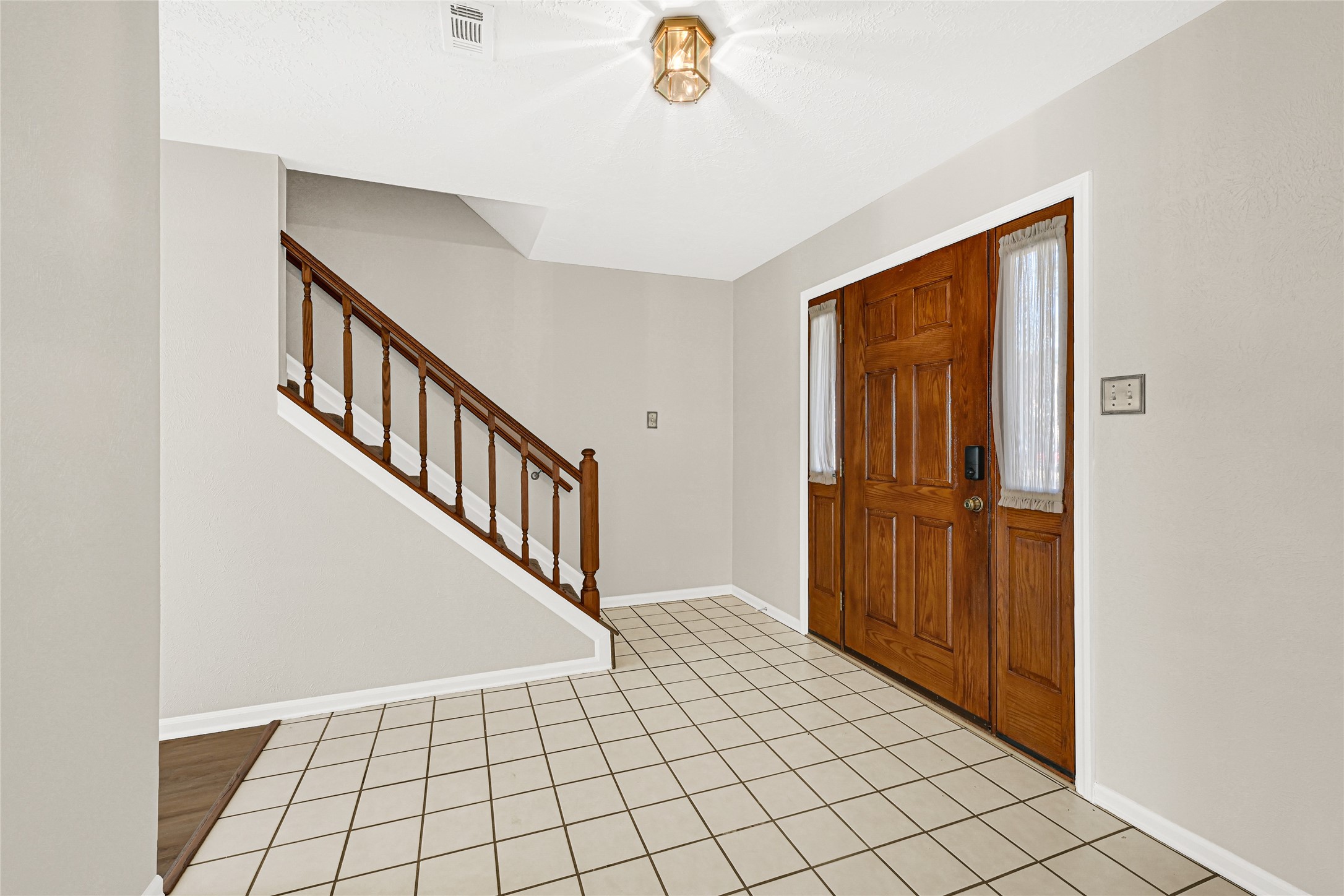 10210 Crooks Way Court Houston, TX 77065 - Photo 7 of 50 a view of an entryway with wooden floor