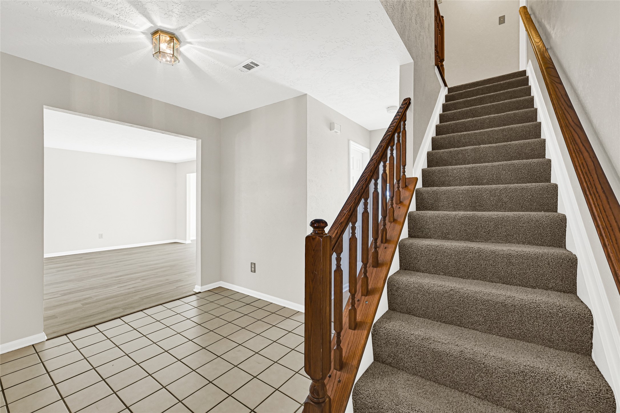 10210 Crooks Way Court Houston, TX 77065 - Photo 8 of 50 a view of an entryway with staircase