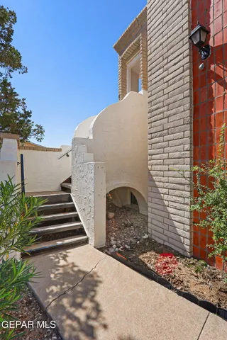 a front view of a house with stairs