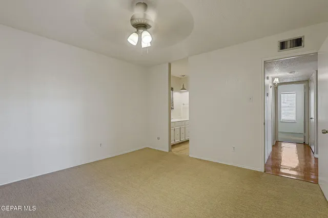 an empty room with a bathroom