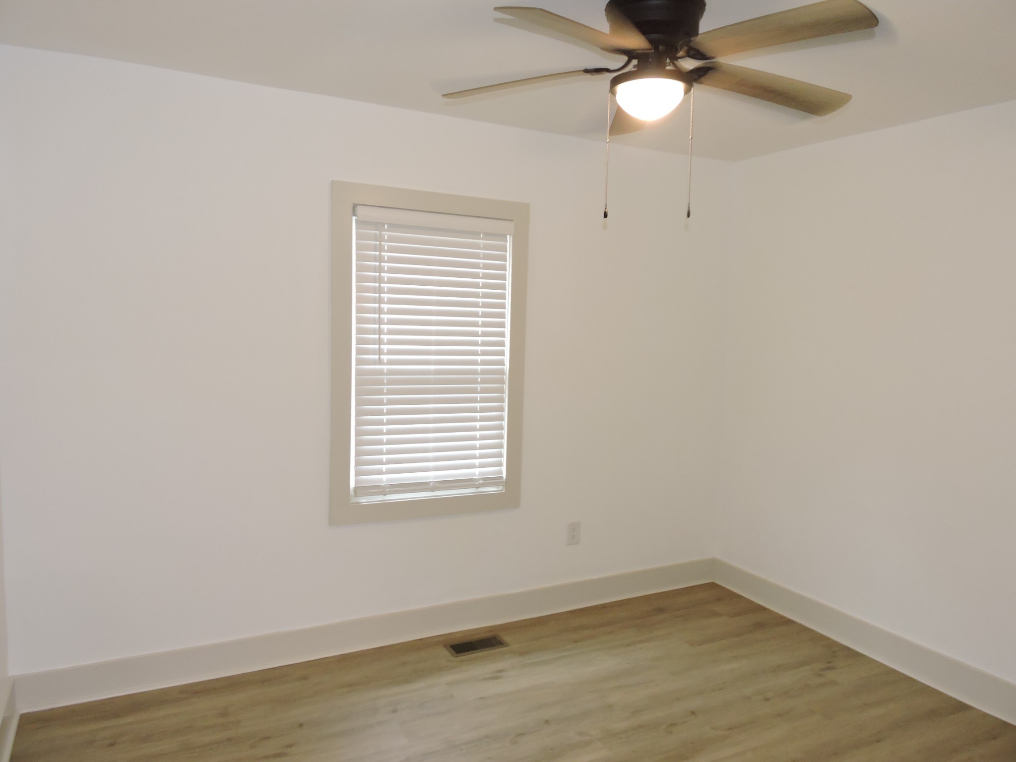 631 Riley Creek Road Tullahoma, TN 37388 - Photo 16 of 27 an empty room with a window and a fan