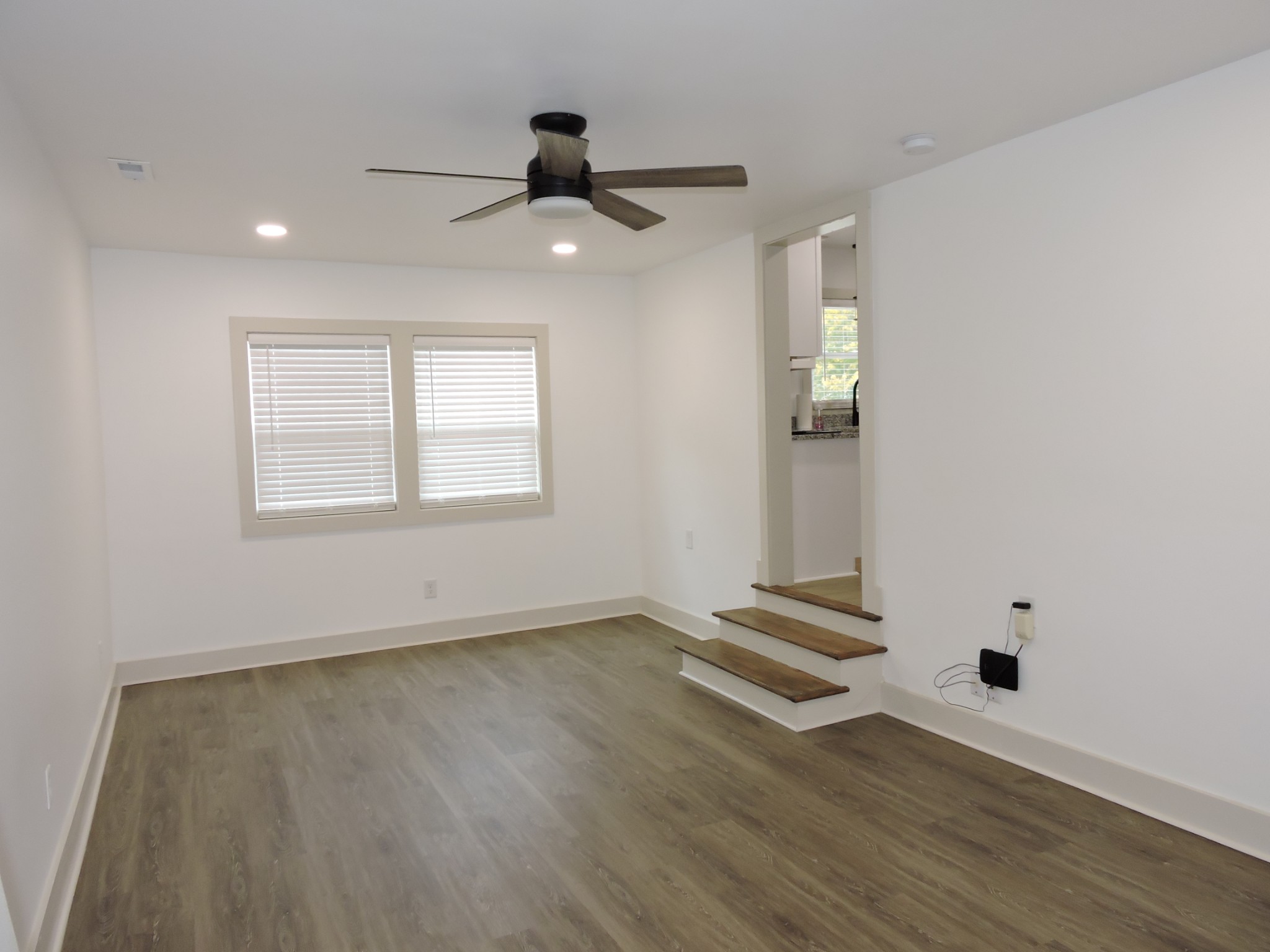 631 Riley Creek Road Tullahoma, TN 37388 - Photo 18 of 27 a view of an empty room with wooden floor and a window