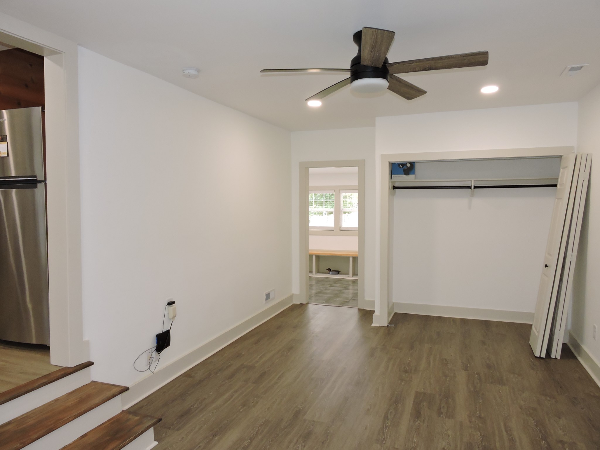 631 Riley Creek Road Tullahoma, TN 37388 - Photo 19 of 27 a view of empty room with wooden floor and fan