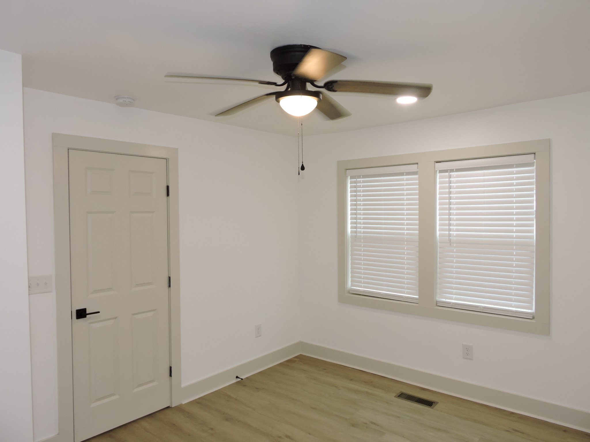 631 Riley Creek Road Tullahoma, TN 37388 - Photo 7 of 27 a view of empty room with wooden floor and fan