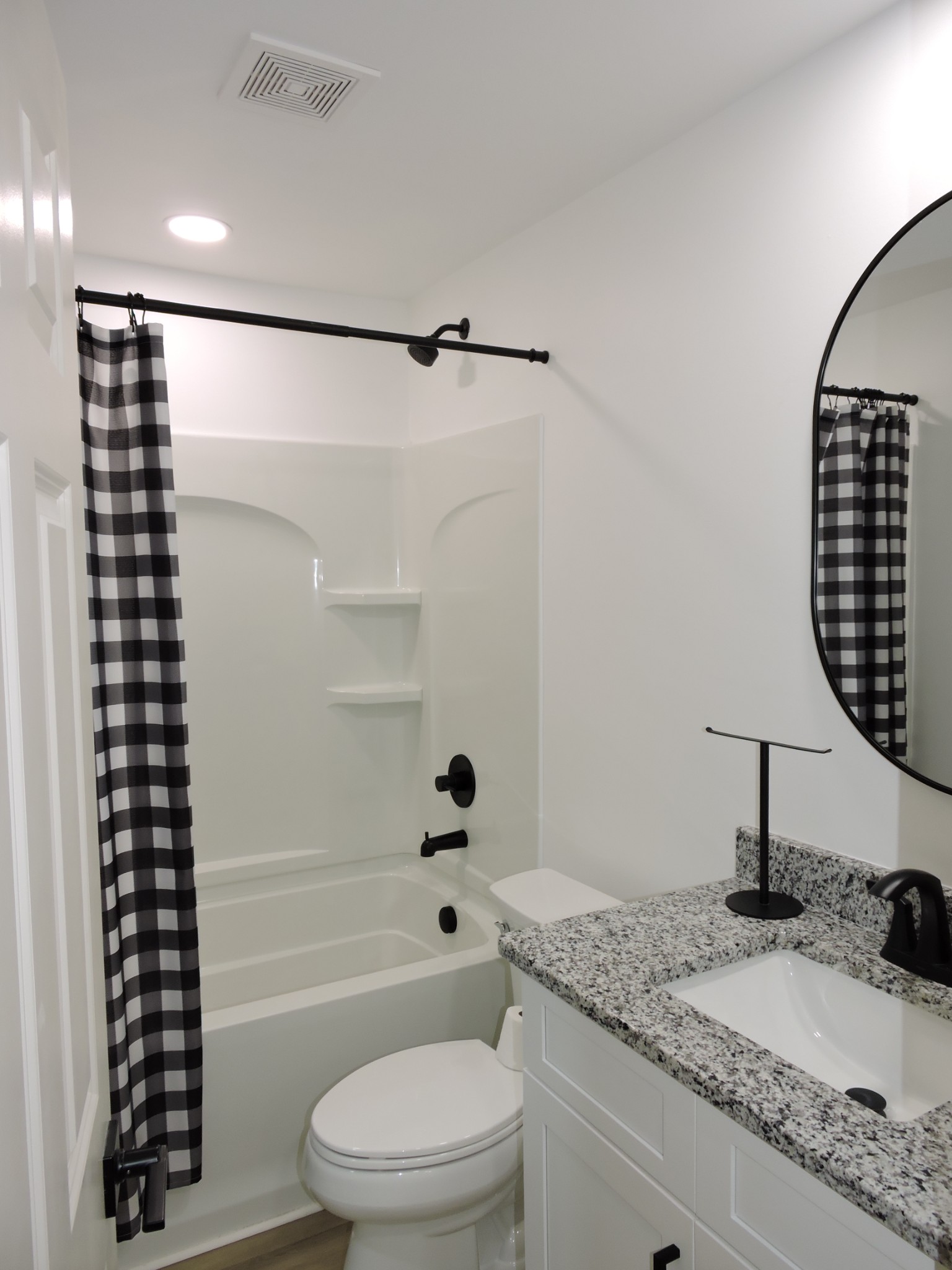 631 Riley Creek Road Tullahoma, TN 37388 - Photo 9 of 27 a bathroom with a granite countertop bathtub shower sink vanity and toilet