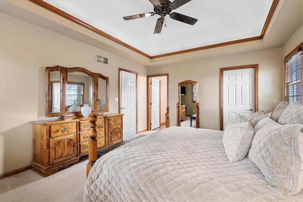 Undisclosed Address Gibsonia, PA 15044 - Photo 16 of 35 a bedroom with a large bed and a chandelier