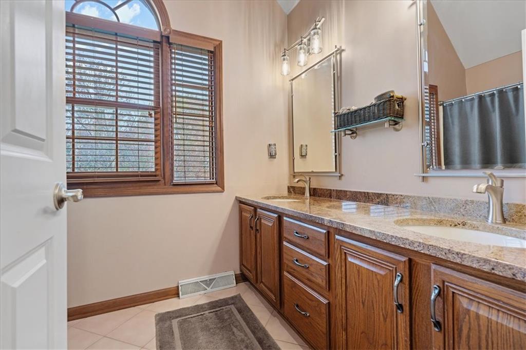 Undisclosed Address Gibsonia, PA 15044 - Photo 20 of 35 a bathroom with a granite countertop sink and a mirror