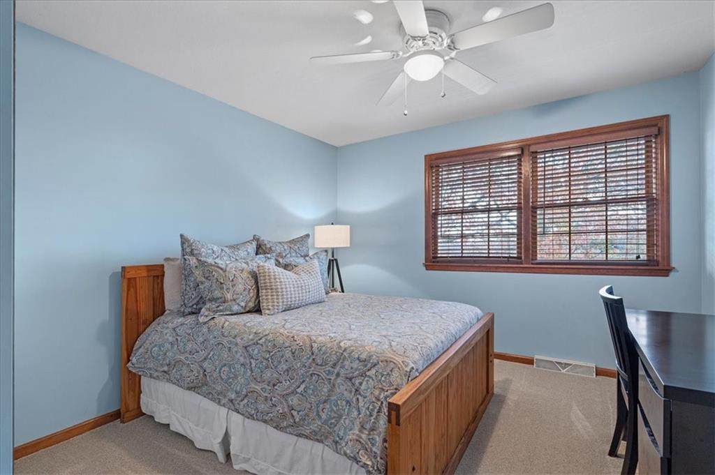 Undisclosed Address Gibsonia, PA 15044 - Photo 24 of 35 a bedroom with a large bed and a desk