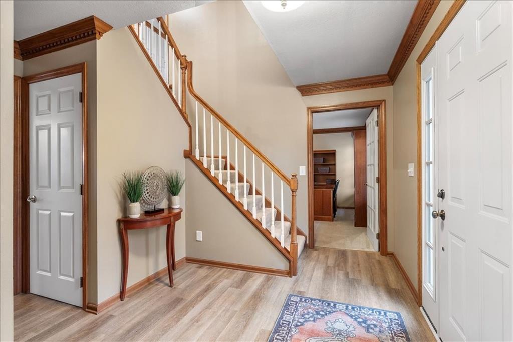Undisclosed Address Gibsonia, PA 15044 - Photo 3 of 35 a view of a hallway with wooden floor and stairs