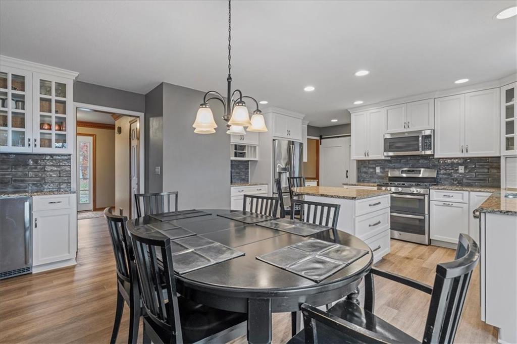 Undisclosed Address Gibsonia, PA 15044 - Photo 10 of 35 a view of a dining room with furniture window and wooden floor