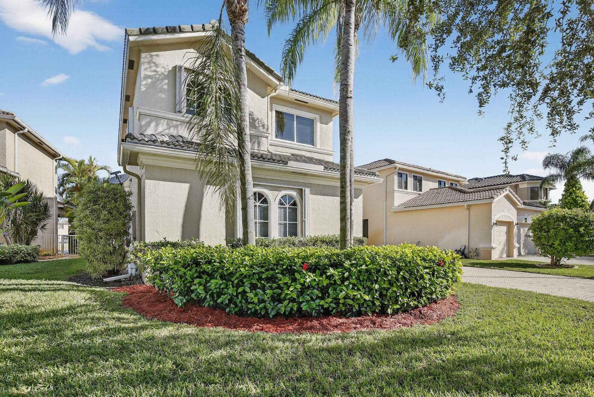 front view of a house with a yard