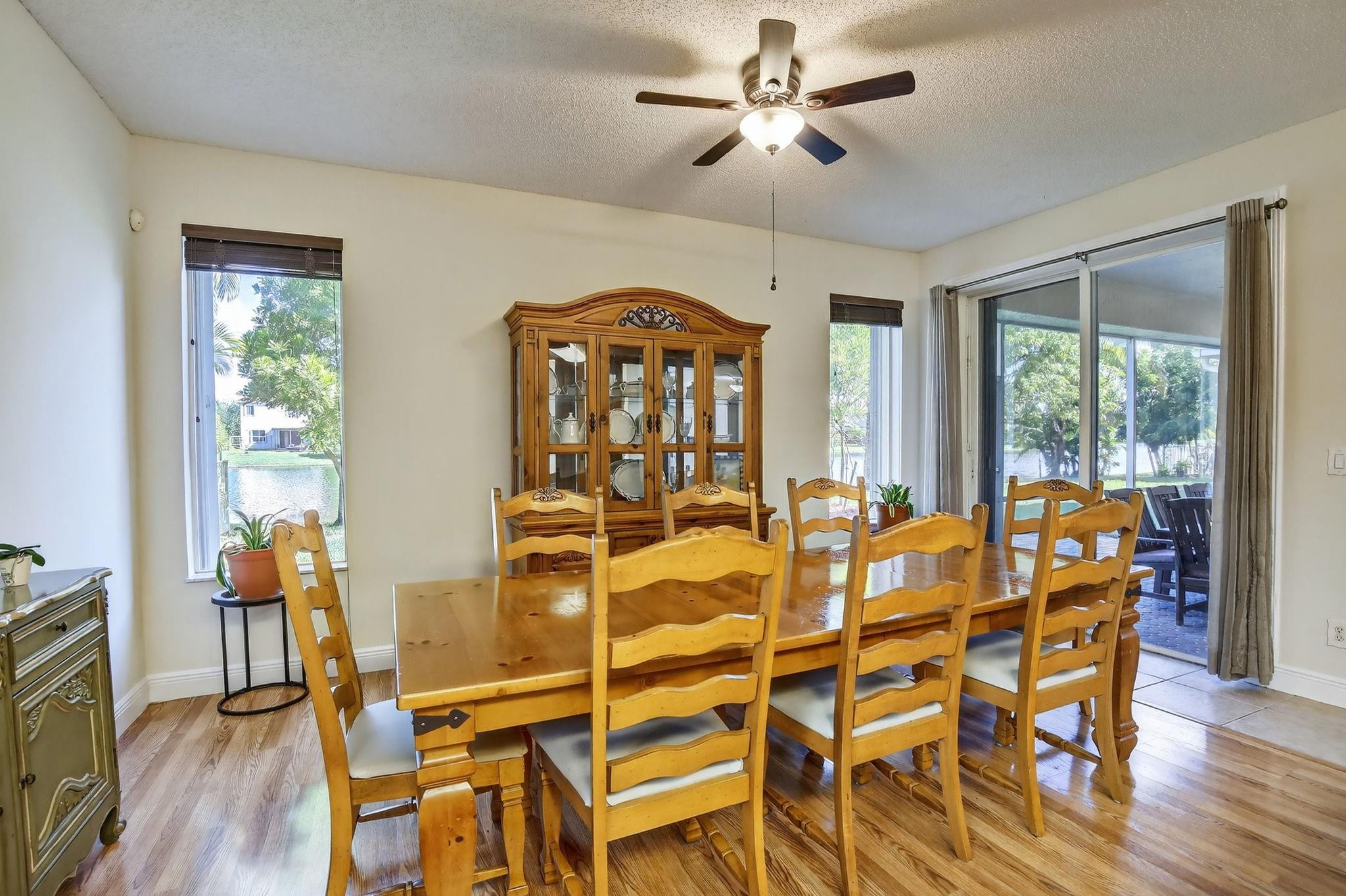 19427 Southwest 65th Street Fort Lauderdale, FL 33332 - Photo 15 of 56 a view of a dining room with furniture window and wooden floor