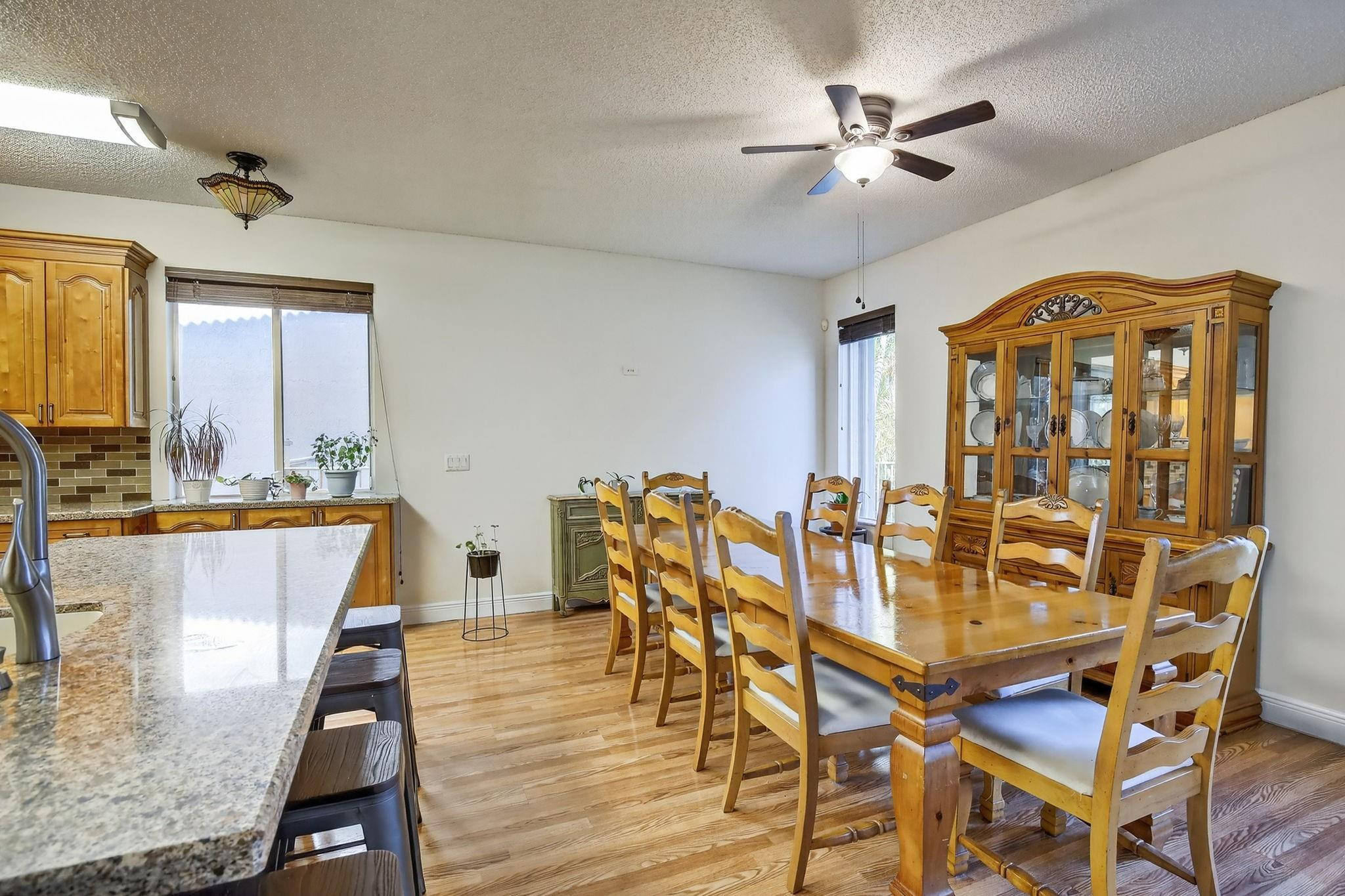 19427 Southwest 65th Street Fort Lauderdale, FL 33332 - Photo 18 of 56 a view of a dining room with furniture and a chandelier