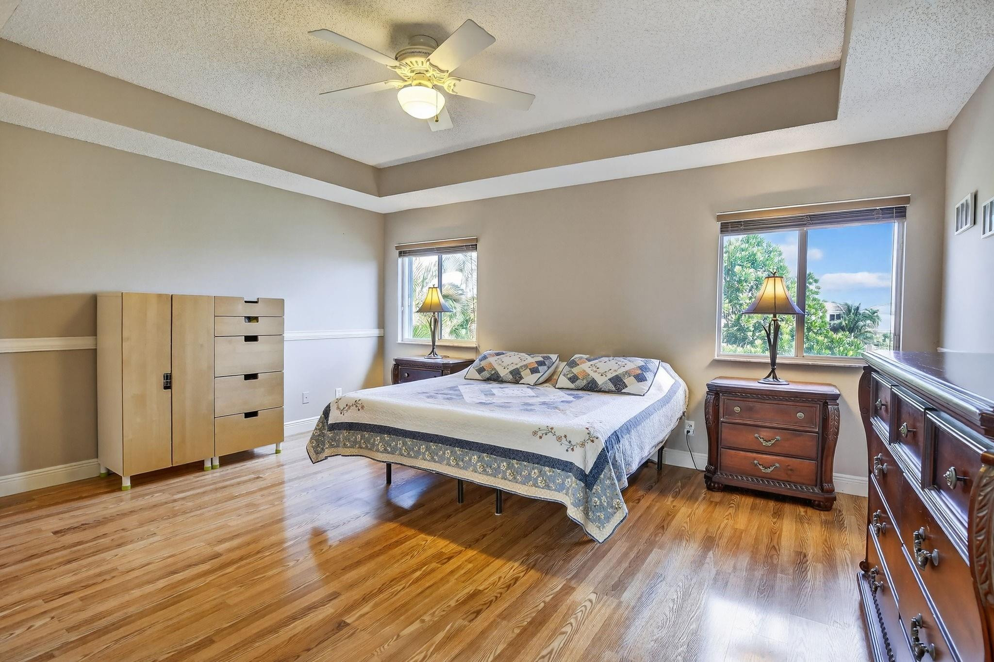 19427 Southwest 65th Street Fort Lauderdale, FL 33332 - Photo 19 of 56 a bedroom with a bed and a dresser