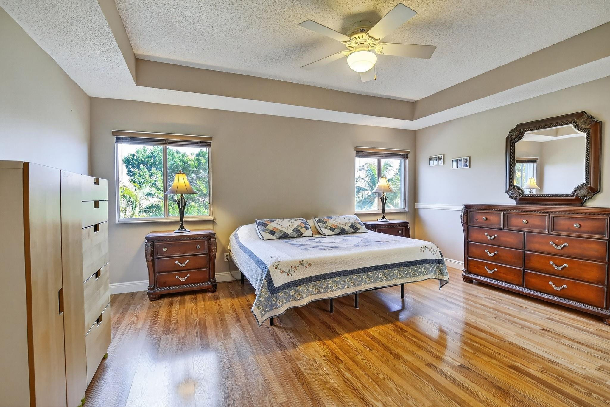 19427 Southwest 65th Street Fort Lauderdale, FL 33332 - Photo 22 of 56 a bedroom with a bed and a dresser