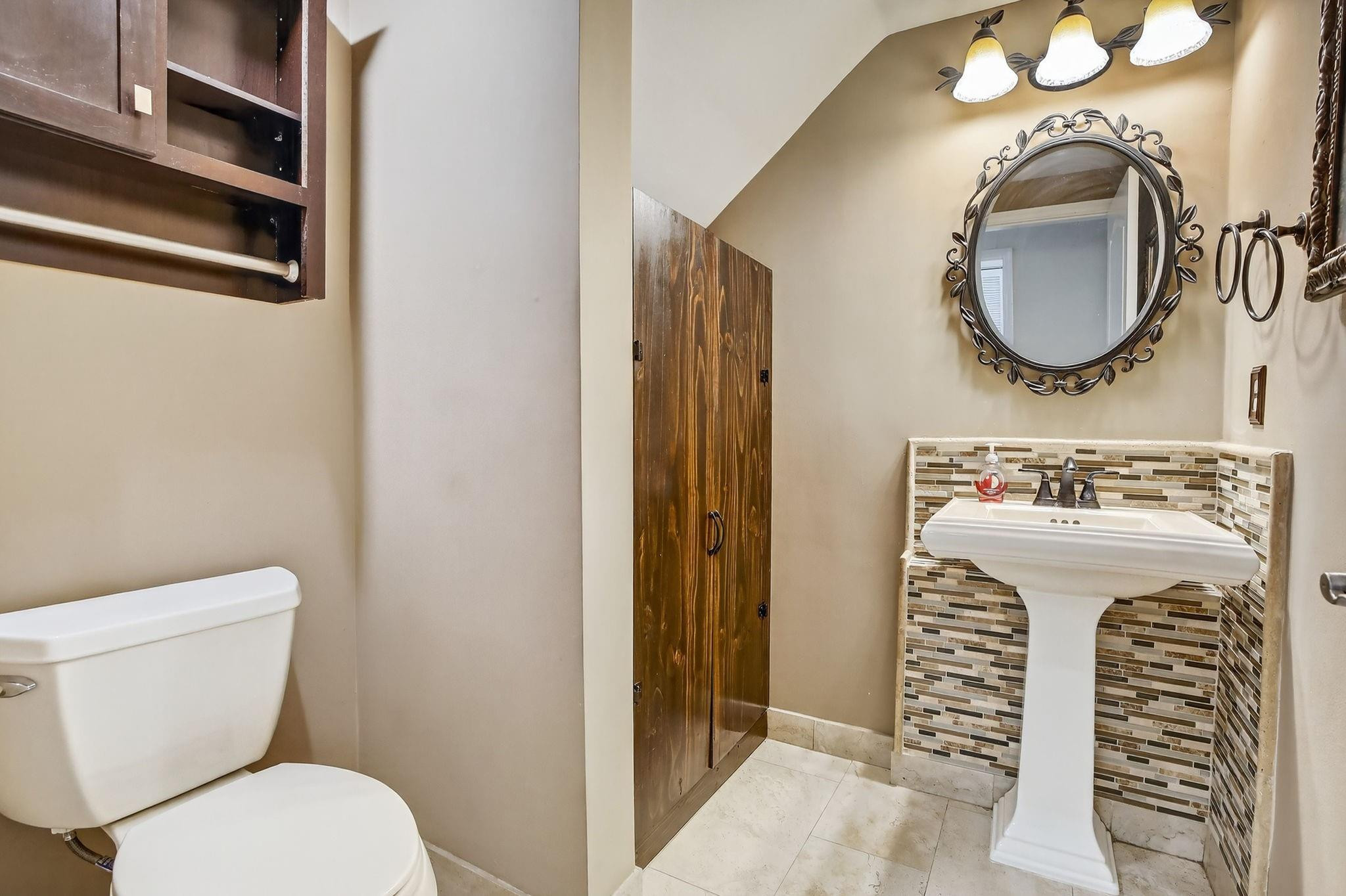 19427 Southwest 65th Street Fort Lauderdale, FL 33332 - Photo 25 of 56 a bathroom with a sink and a mirror