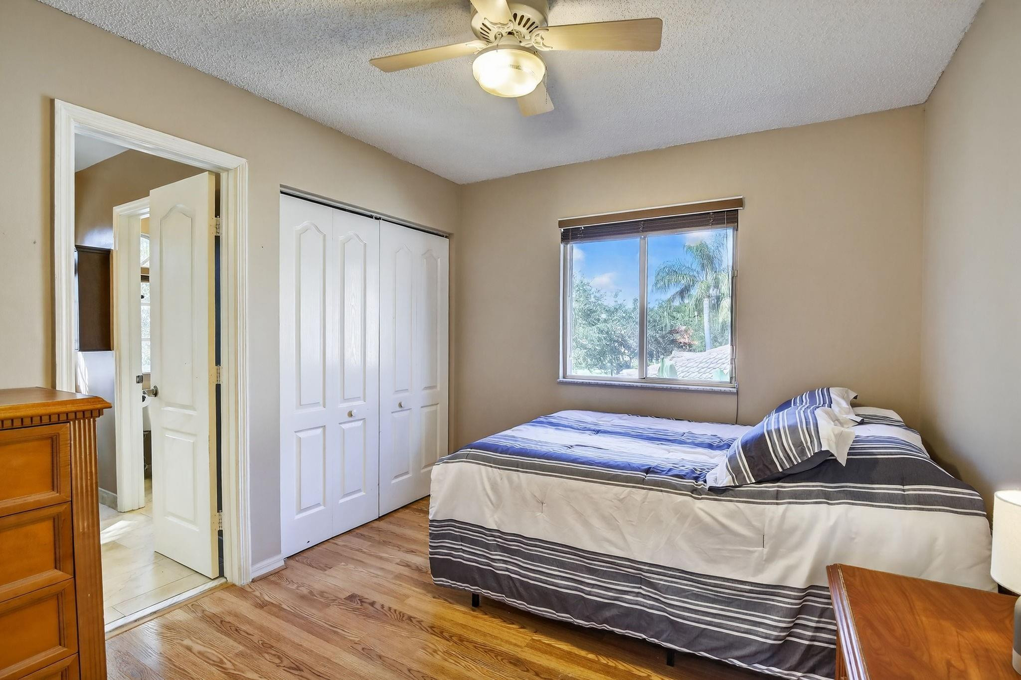 19427 Southwest 65th Street Fort Lauderdale, FL 33332 - Photo 28 of 56 a bedroom with a bed and a window
