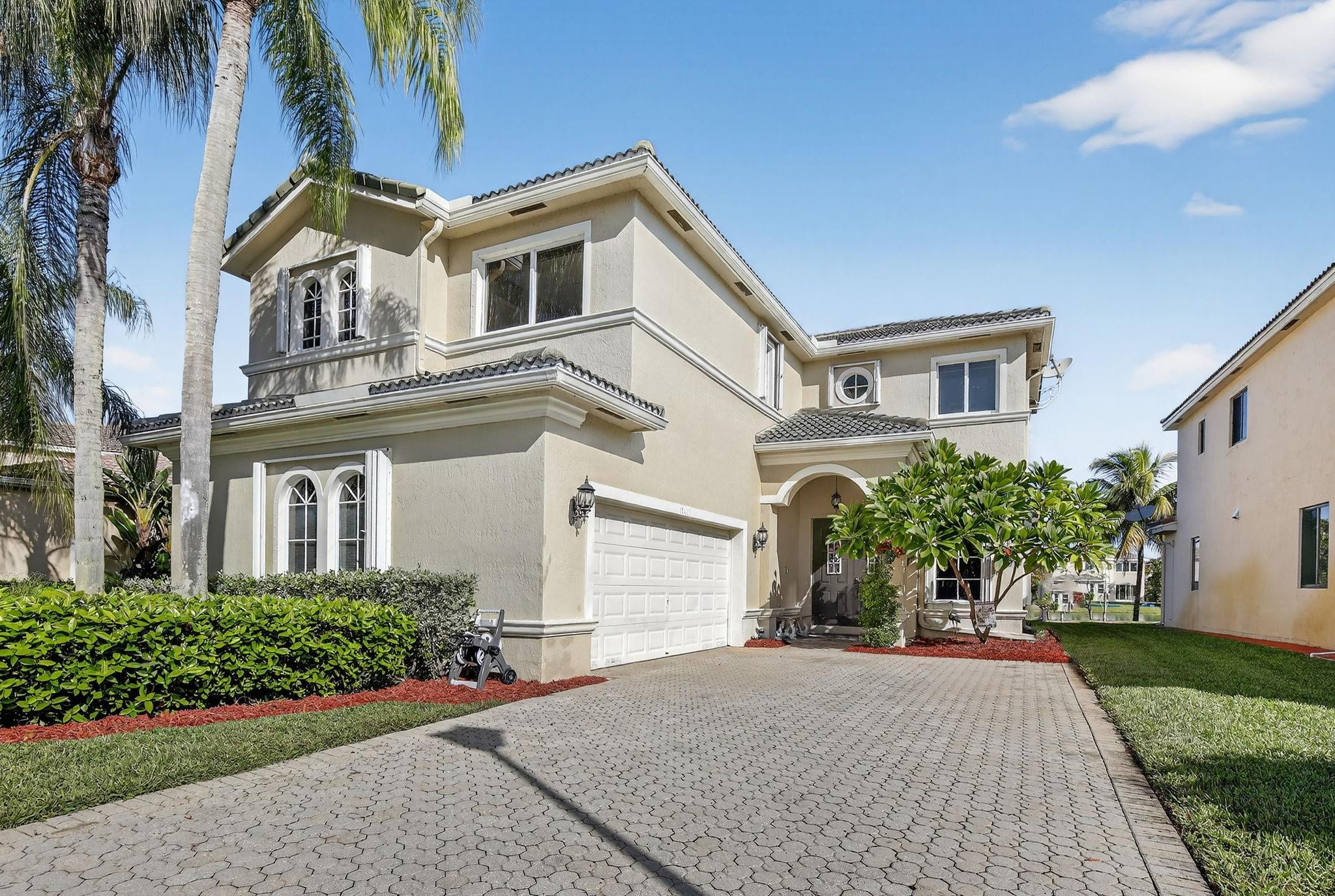 19427 Southwest 65th Street Fort Lauderdale, FL 33332 - Photo 3 of 56 front view of a house with a yard