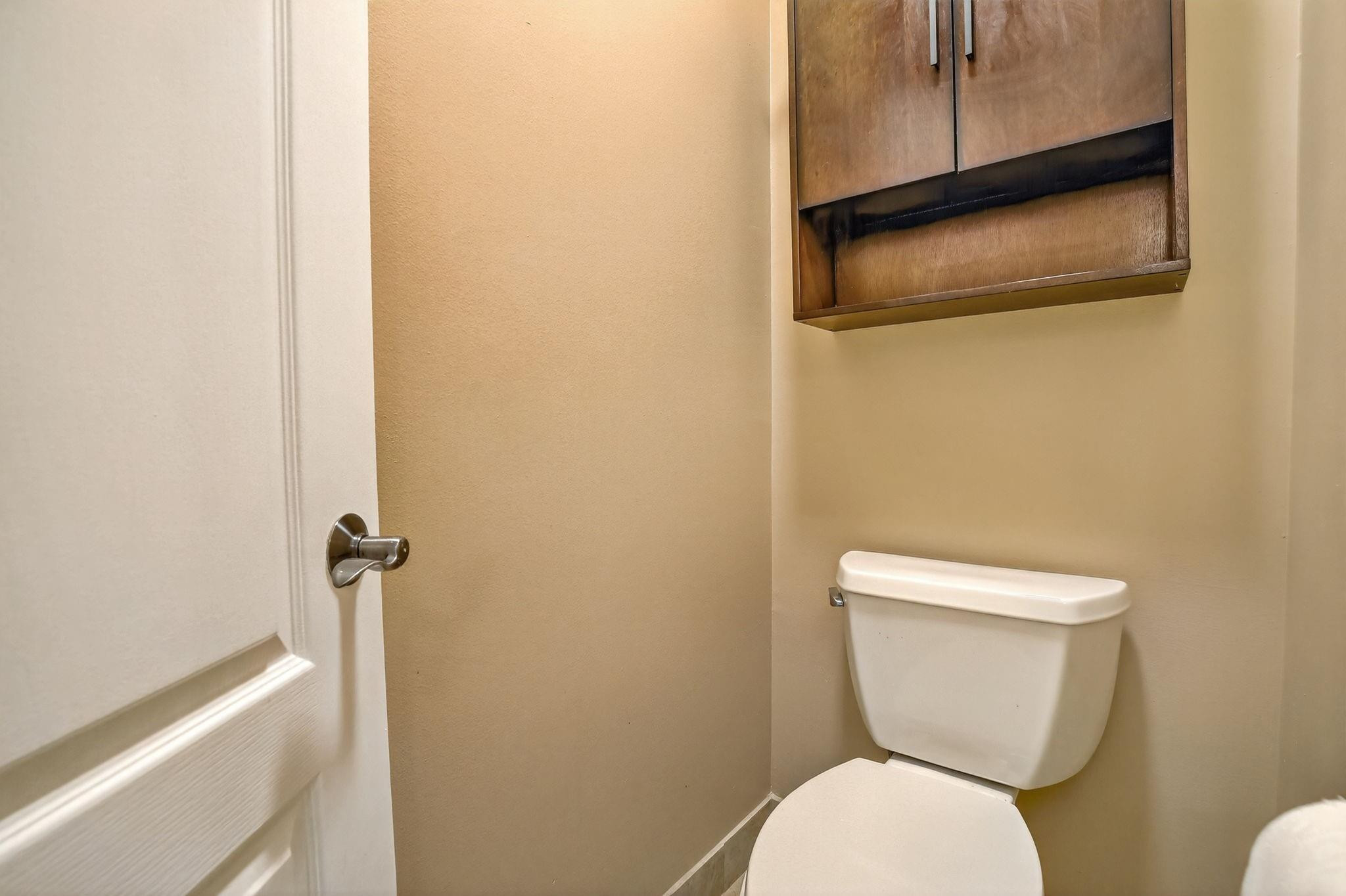 19427 Southwest 65th Street Fort Lauderdale, FL 33332 - Photo 39 of 56 a white toilet sitting next to a sink