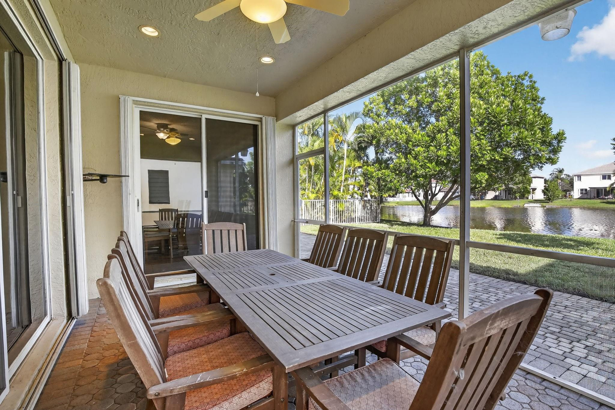 19427 Southwest 65th Street Fort Lauderdale, FL 33332 - Photo 42 of 56 a view of a patio with a table chairs and a backyard