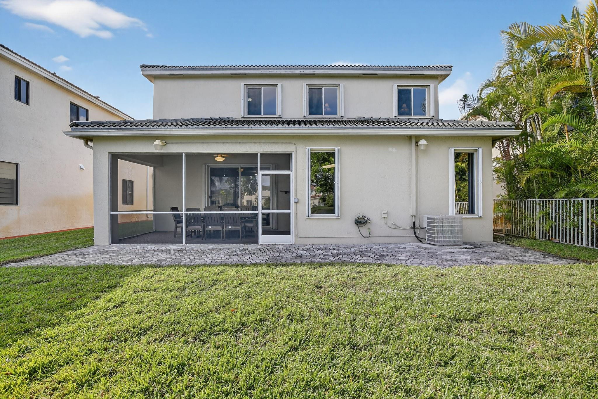 19427 Southwest 65th Street Fort Lauderdale, FL 33332 - Photo 45 of 56 a front view of a house with a yard