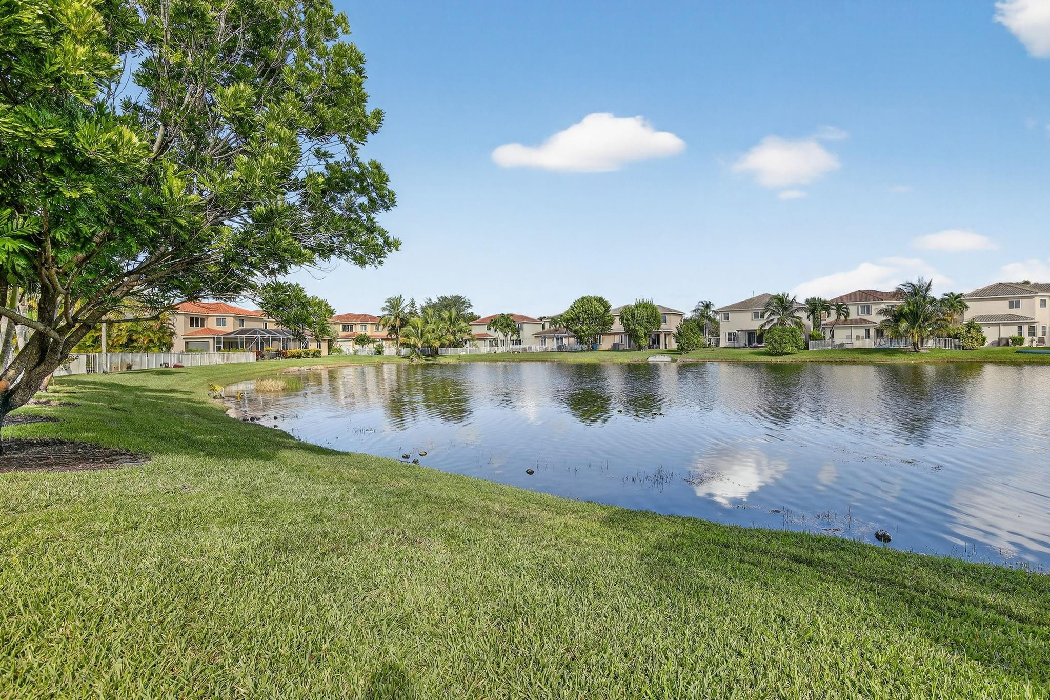 19427 Southwest 65th Street Fort Lauderdale, FL 33332 - Photo 47 of 56 a view of a lake with houses in the background