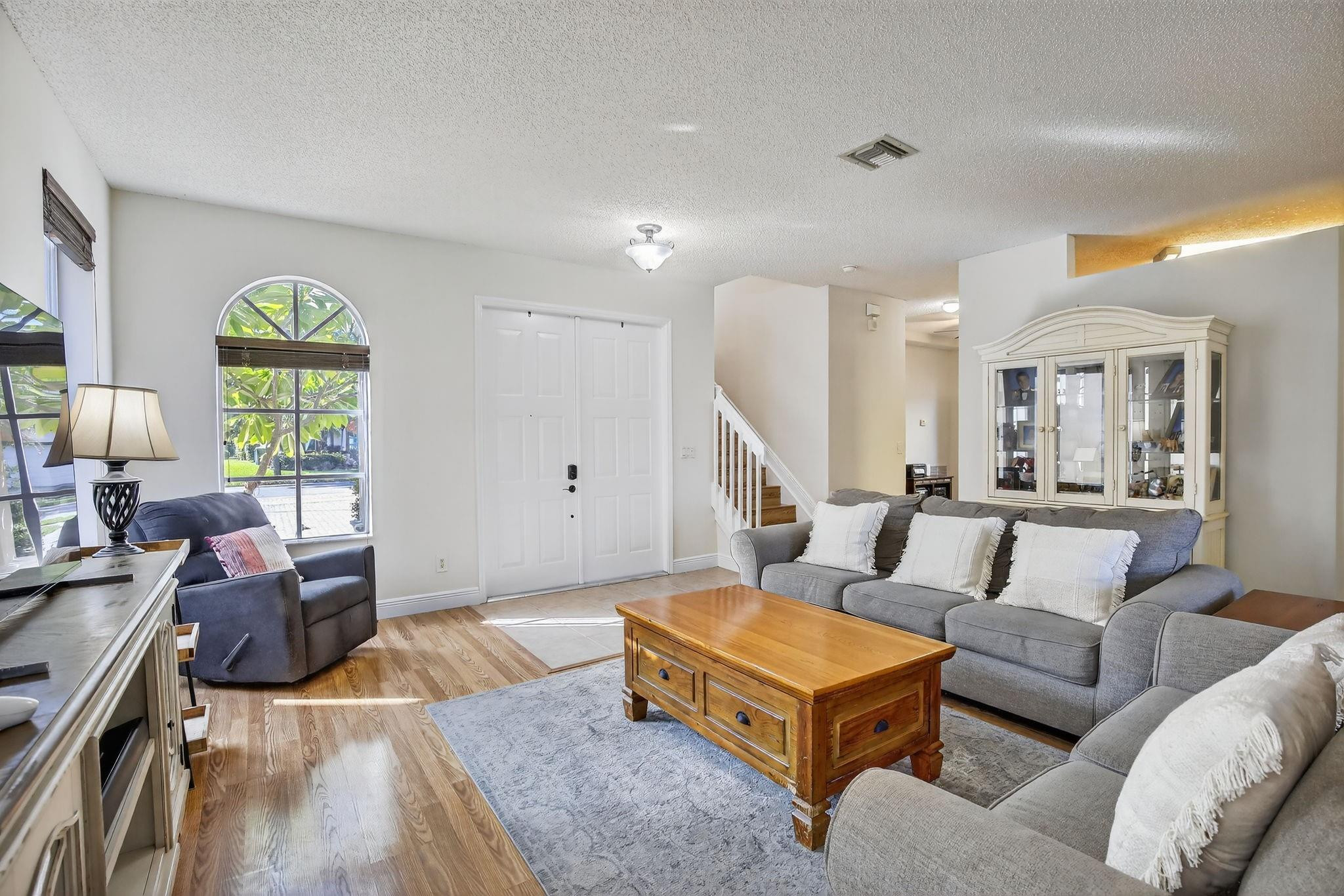 19427 Southwest 65th Street Fort Lauderdale, FL 33332 - Photo 5 of 56 a living room with furniture and a large window