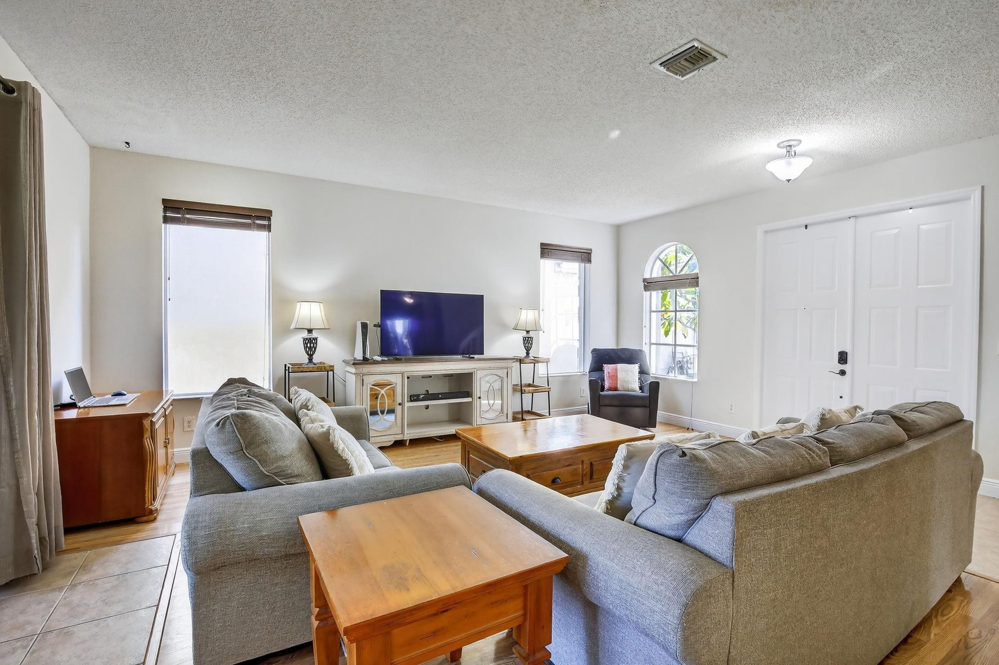 19427 Southwest 65th Street Fort Lauderdale, FL 33332 - Photo 6 of 56 a living room with furniture and a flat screen tv
